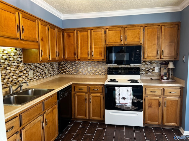 kitchen with black appliances, light countertops, a sink, and wood finish floors