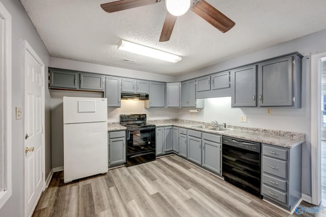 kitchen featuring light hardwood / wood-style flooring, black appliances, gray cabinetry, a textured ceiling, and ceiling fan