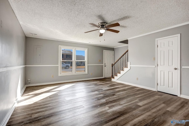 spare room with ceiling fan, a textured ceiling, and hardwood / wood-style flooring