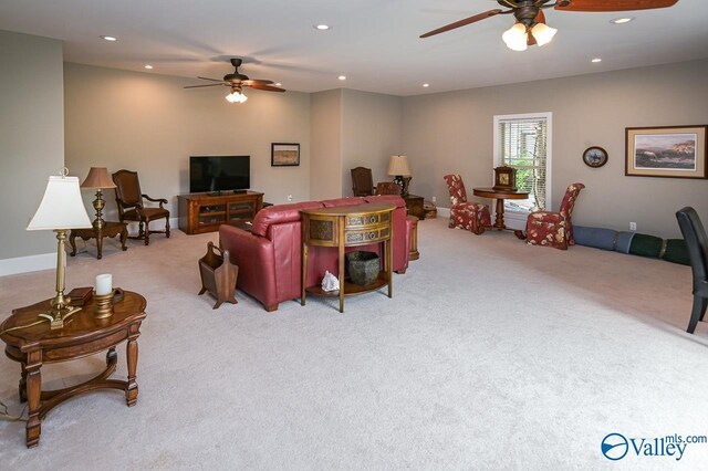 living room featuring light colored carpet and ceiling fan