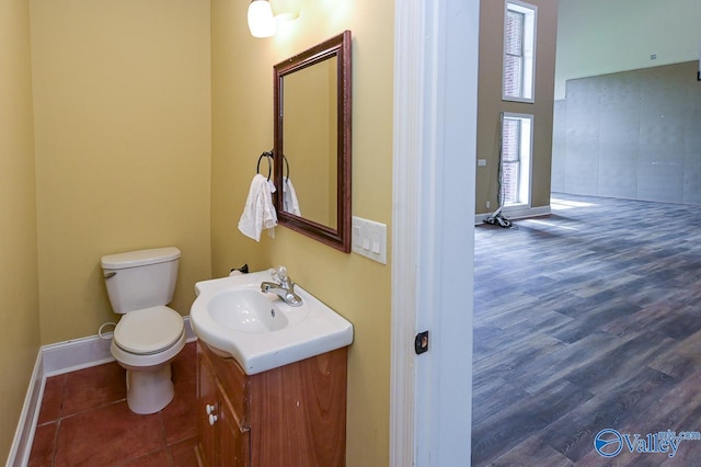 bathroom featuring hardwood / wood-style floors, toilet, and vanity