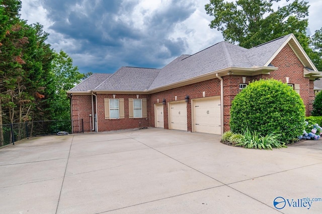 view of side of property with a garage