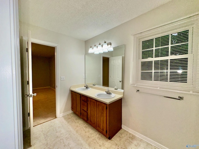 bathroom featuring vanity and a textured ceiling