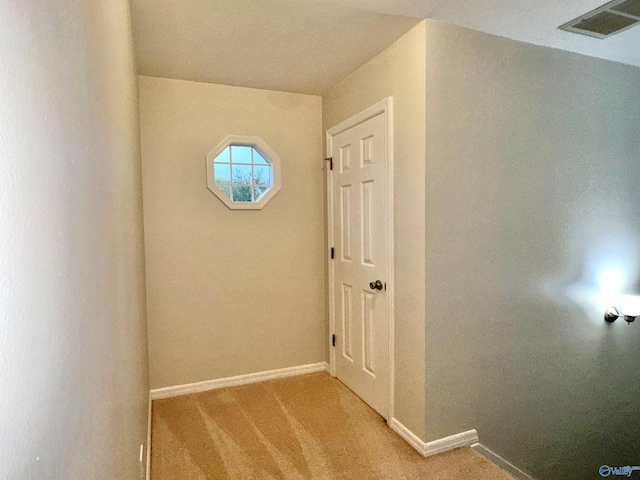 hallway with light carpet