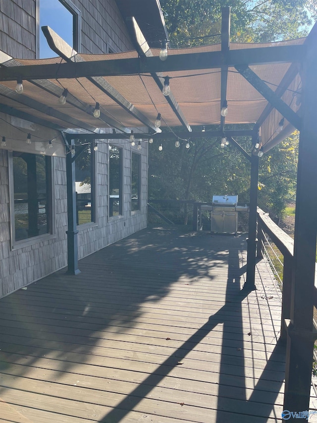 wooden deck featuring a pergola