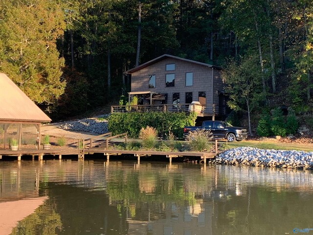 back of house featuring a water view