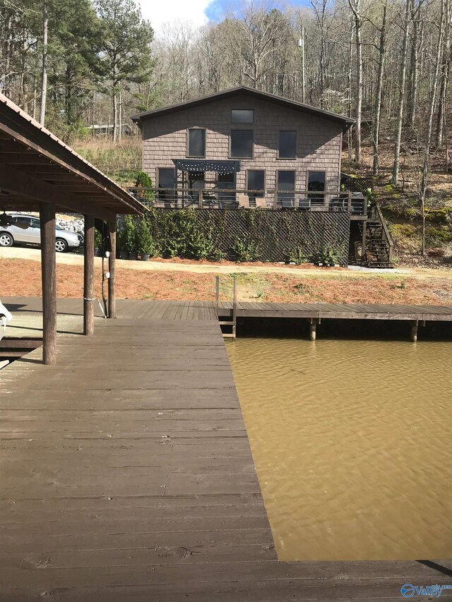 dock area with a water view