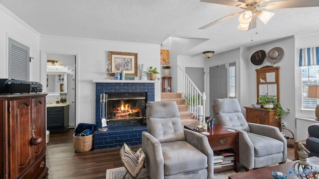 11112 Memorial Pkwy S Unit N3, Huntsville, AL 35803 - living room with dark wood-style floors, stairs, a textured ceiling, a fireplace, and ceiling fan