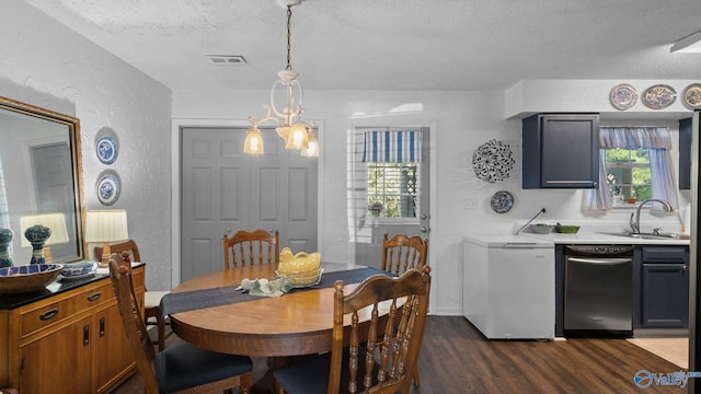 11112 Memorial Pkwy S Unit N3, Huntsville, AL 35803 - dining space with a textured wall, a textured ceiling, dark wood-style flooring, and plenty of natural light