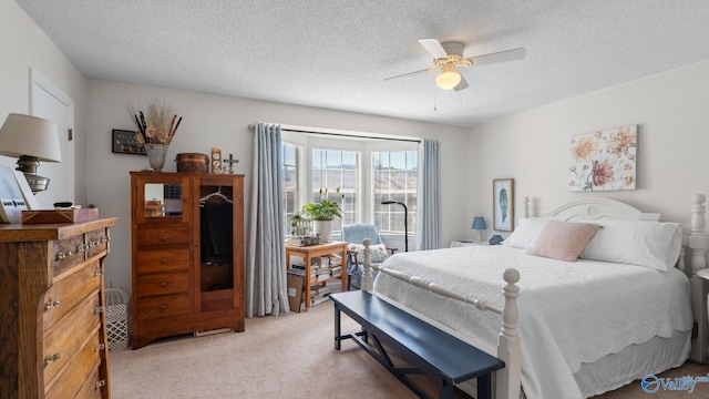 11112 Memorial Pkwy S Unit N3, Huntsville, AL 35803 - bedroom with light carpet, a ceiling fan, and a textured ceiling