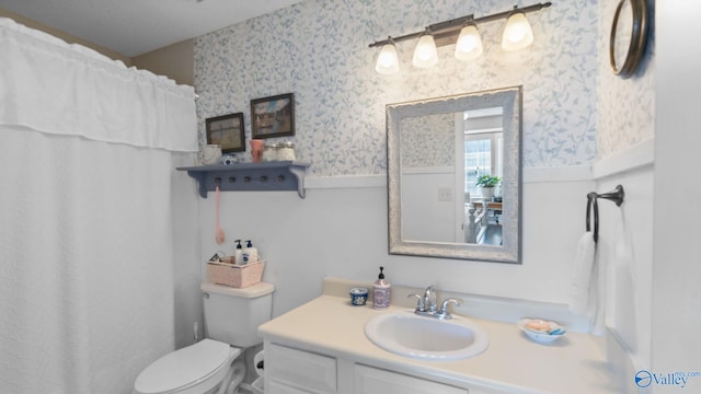 11112 Memorial Pkwy S Unit N3, Huntsville, AL 35803 - bathroom featuring wallpapered walls, vanity, toilet, wainscoting, and a shower with curtain