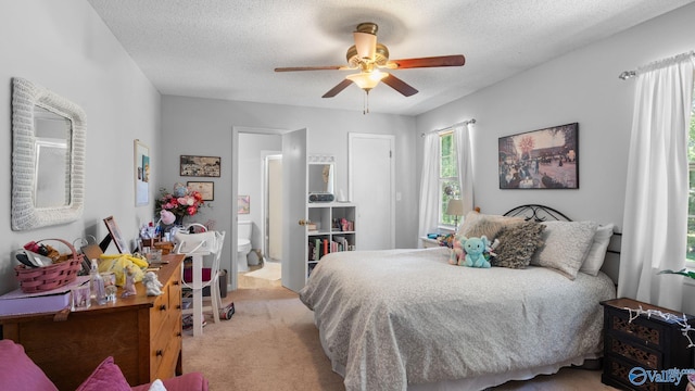 11112 Memorial Pkwy S Unit N3, Huntsville, AL 35803 - bedroom with light carpet, a textured ceiling, and a ceiling fan