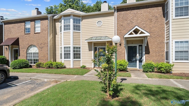 11112 Memorial Pkwy S Unit N3, Huntsville, AL 35803 - multi unit property featuring a chimney, uncovered parking, and brick siding