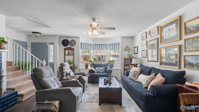 11112 Memorial Pkwy S Unit N3, Huntsville, AL 35803 - living room with ceiling fan, stairway, a textured ceiling, and ornamental molding
