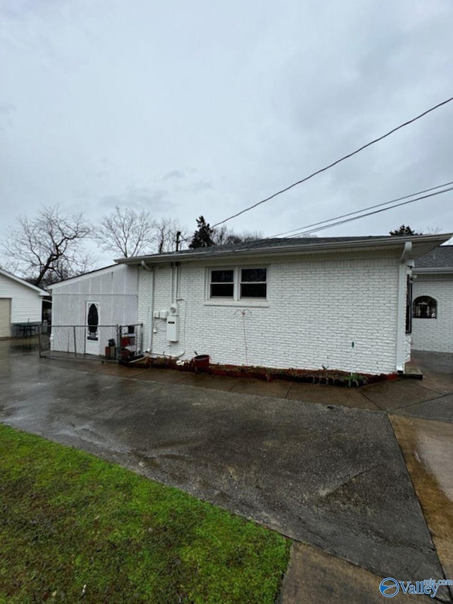 view of home's exterior featuring brick siding