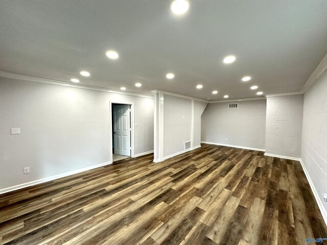 interior space featuring ornamental molding, a textured ceiling, dark wood-type flooring, and french doors