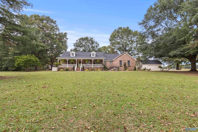 view of front of home featuring a front lawn and covered porch