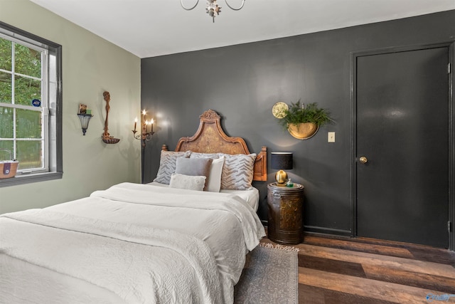 bedroom featuring dark wood-type flooring