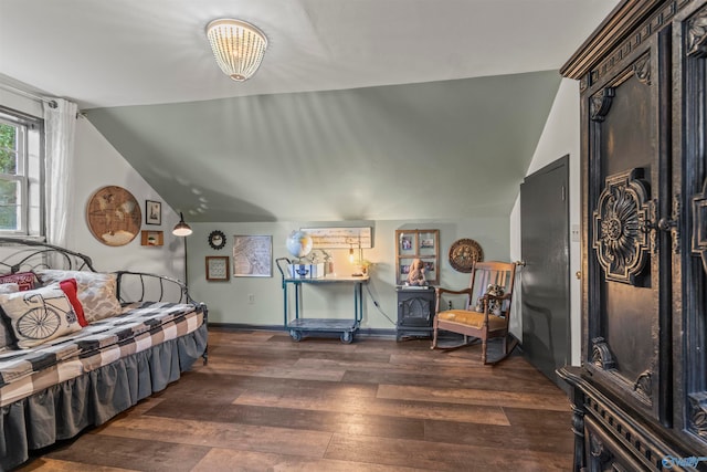 living area featuring lofted ceiling and dark hardwood / wood-style floors