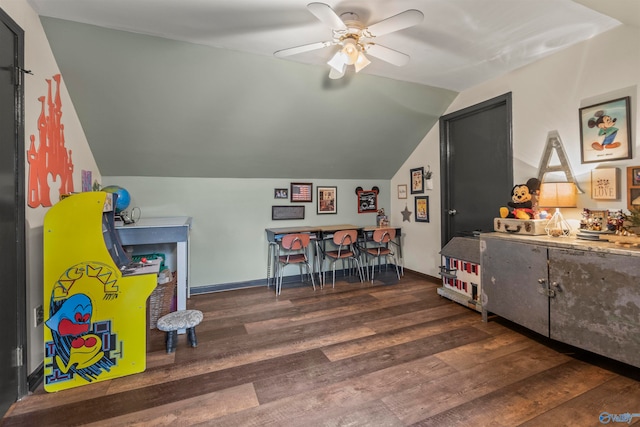 rec room with ceiling fan, vaulted ceiling, and dark hardwood / wood-style flooring