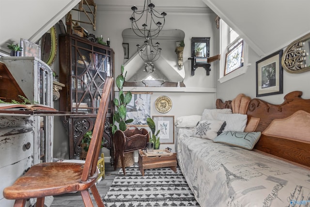 living room with crown molding, hardwood / wood-style floors, and a chandelier