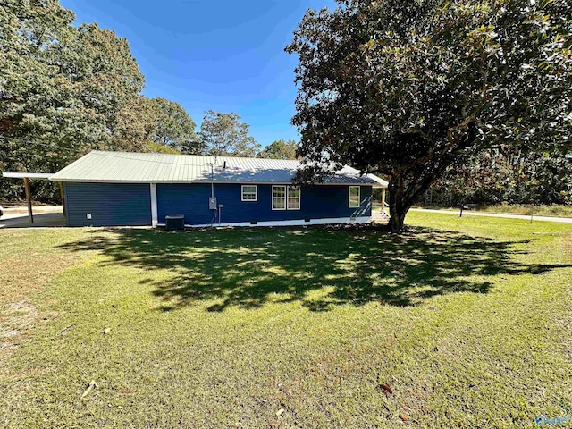 view of front of home with a front yard and cooling unit