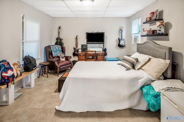 bedroom featuring a paneled ceiling