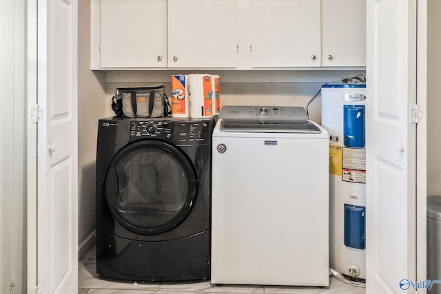 washroom featuring cabinets, washer and clothes dryer, and water heater