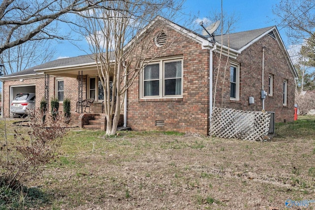 exterior space with a garage and a front lawn