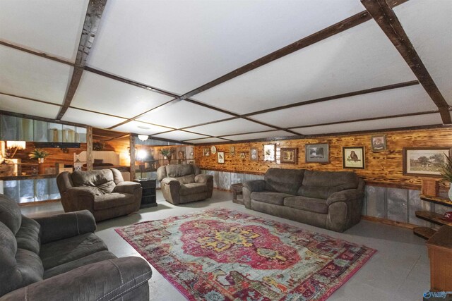 living room with wood walls