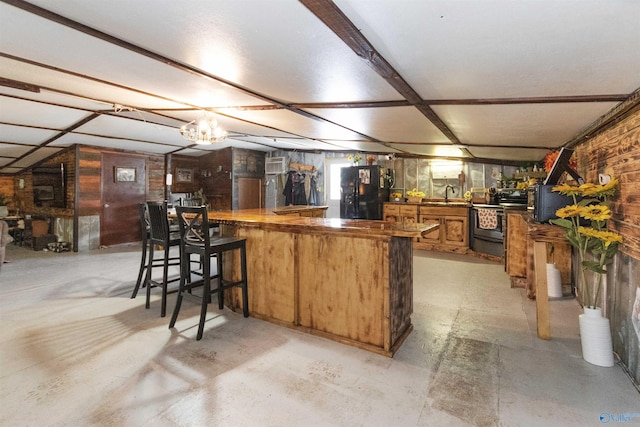 kitchen with range with electric cooktop, concrete floors, brown cabinets, black refrigerator with ice dispenser, and a sink