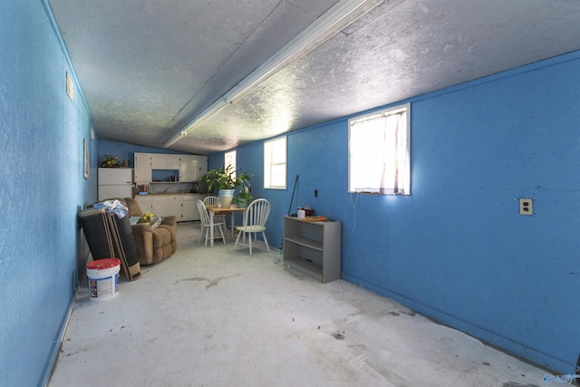 interior space featuring freestanding refrigerator