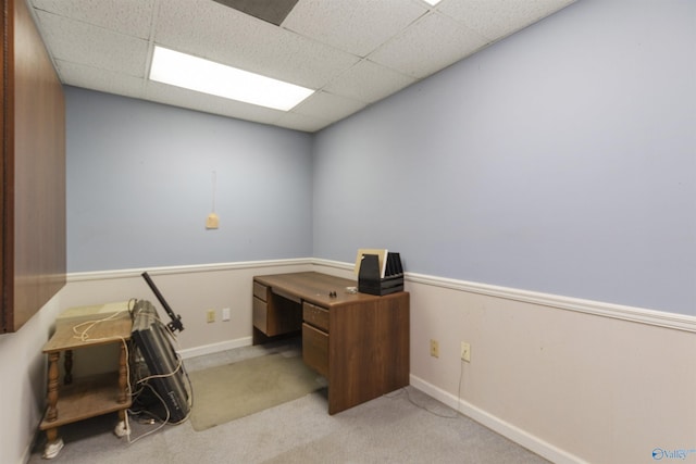 home office featuring a drop ceiling, baseboards, and carpet floors