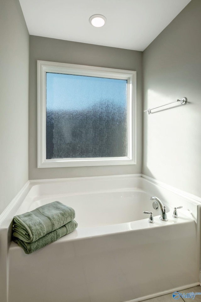 bathroom featuring a tub to relax in