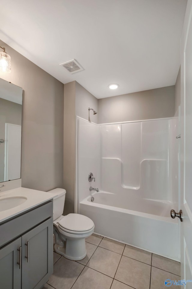 full bathroom with tile patterned flooring, vanity, shower / bath combination, and toilet