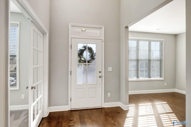 entrance foyer featuring dark hardwood / wood-style flooring and french doors