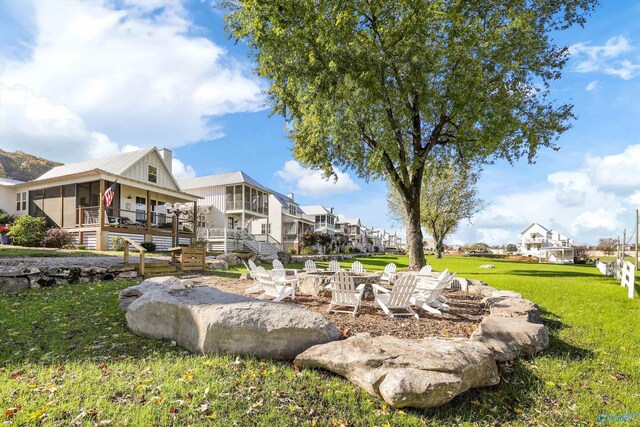 exterior space with a yard, a fire pit, and a deck