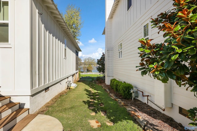 view of property exterior featuring a lawn