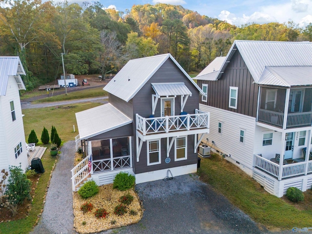 view of front of property with a balcony