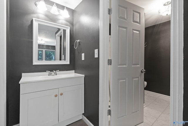 929 Carroll Rd, Harvest, AL 35759 - bathroom featuring marble finish floors, baseboards, vanity, and toilet