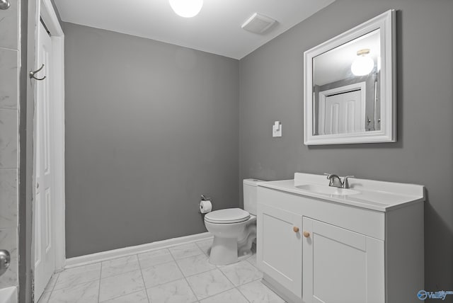 929 Carroll Rd, Harvest, AL 35759 - bathroom featuring marble finish flooring, toilet, vanity, and baseboards