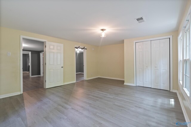 929 Carroll Rd, Harvest, AL 35759 - unfurnished bedroom with wood finished floors, baseboards, and a closet