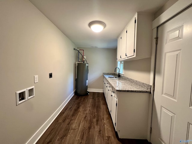 2061 Lindsay Ln S, Athens, AL 35613 - laundry room with a sink, electric dryer hookup, baseboards, water heater, and dark wood-type flooring