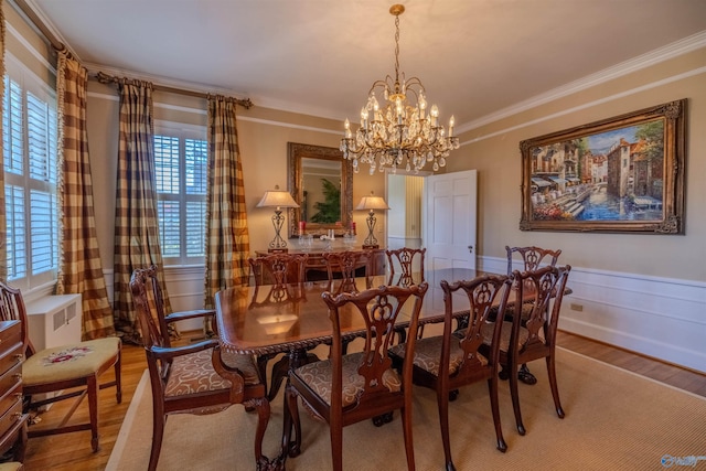 260 Bexar Ave W, Hamilton, AL 35570 - dining room featuring a wainscoted wall, ornamental molding, wood finished floors, and an inviting chandelier