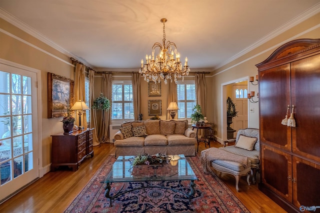 260 Bexar Ave W, Hamilton, AL 35570 - living room featuring baseboards, ornamental molding, wood finished floors, and a notable chandelier