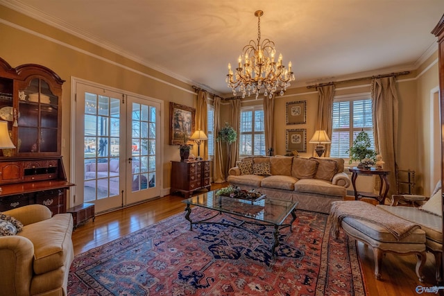 260 Bexar Ave W, Hamilton, AL 35570 - living room featuring an inviting chandelier, ornamental molding, french doors, and wood finished floors