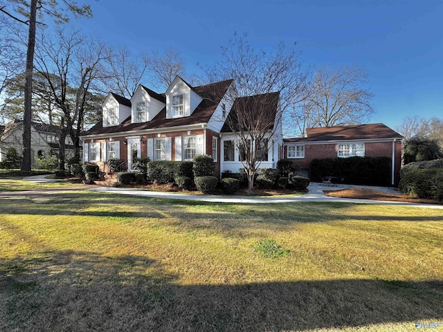 260 Bexar Ave W, Hamilton, AL 35570 - cape cod home with brick siding and a front yard