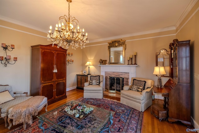 260 Bexar Ave W, Hamilton, AL 35570 - living room featuring a chandelier, baseboards, ornamental molding, wood finished floors, and a fireplace