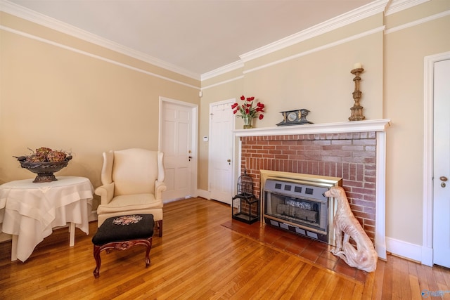 260 Bexar Ave W, Hamilton, AL 35570 - living area with baseboards, a fireplace, wood finished floors, and ornamental molding