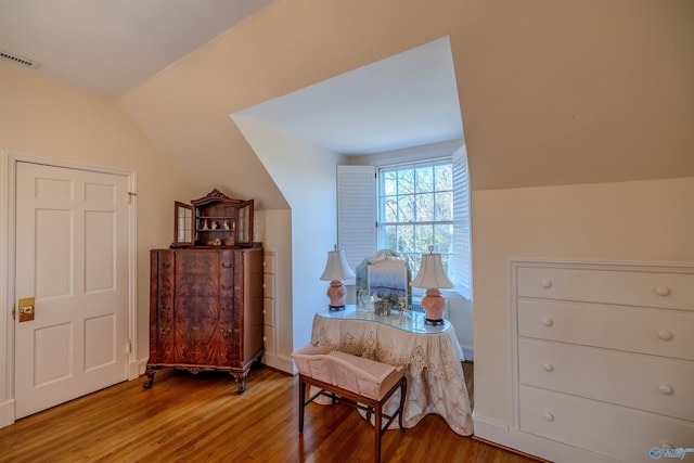 260 Bexar Ave W, Hamilton, AL 35570 - living area featuring lofted ceiling, visible vents, and wood finished floors